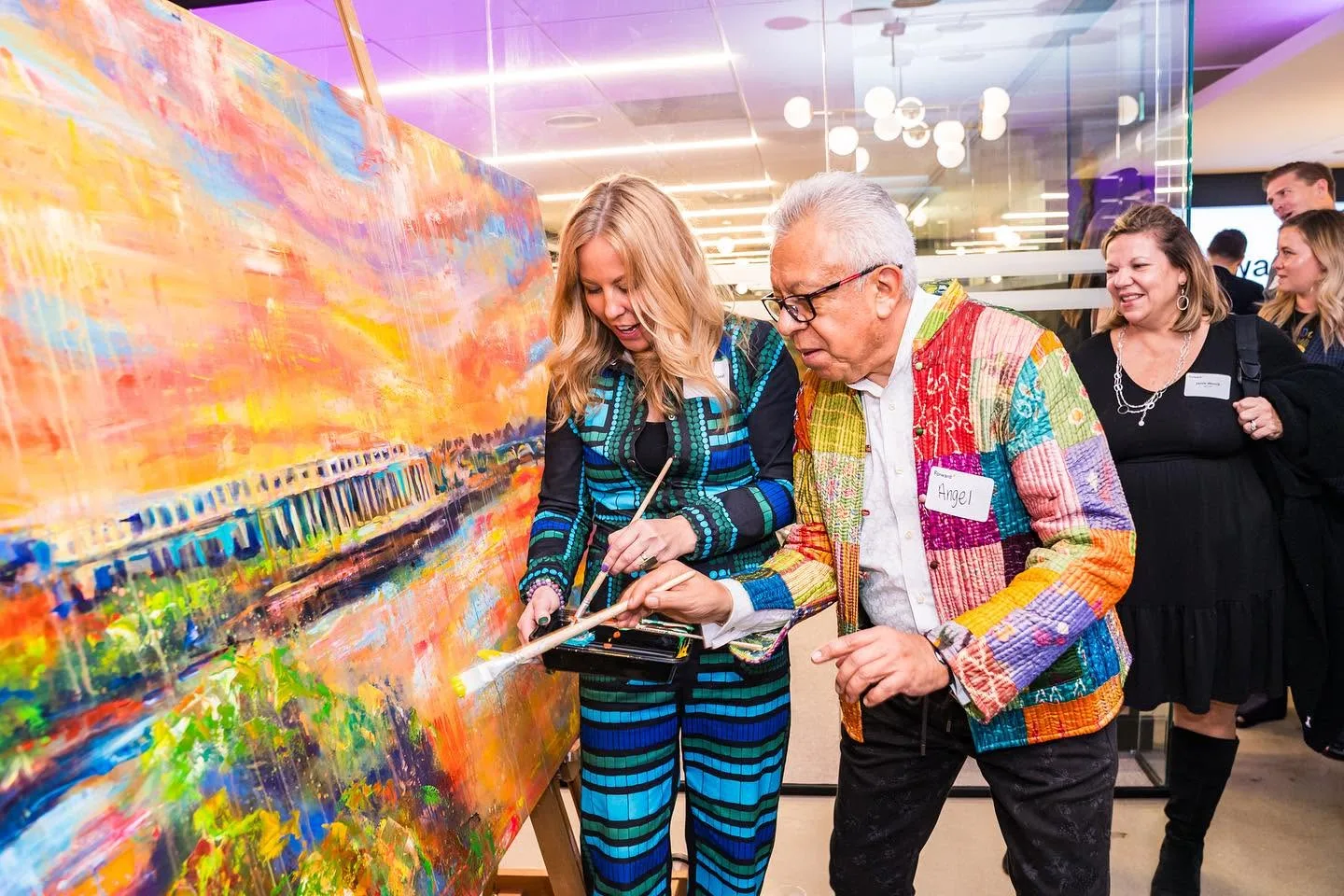 Guests painting together at a corporate reception in Washington DC