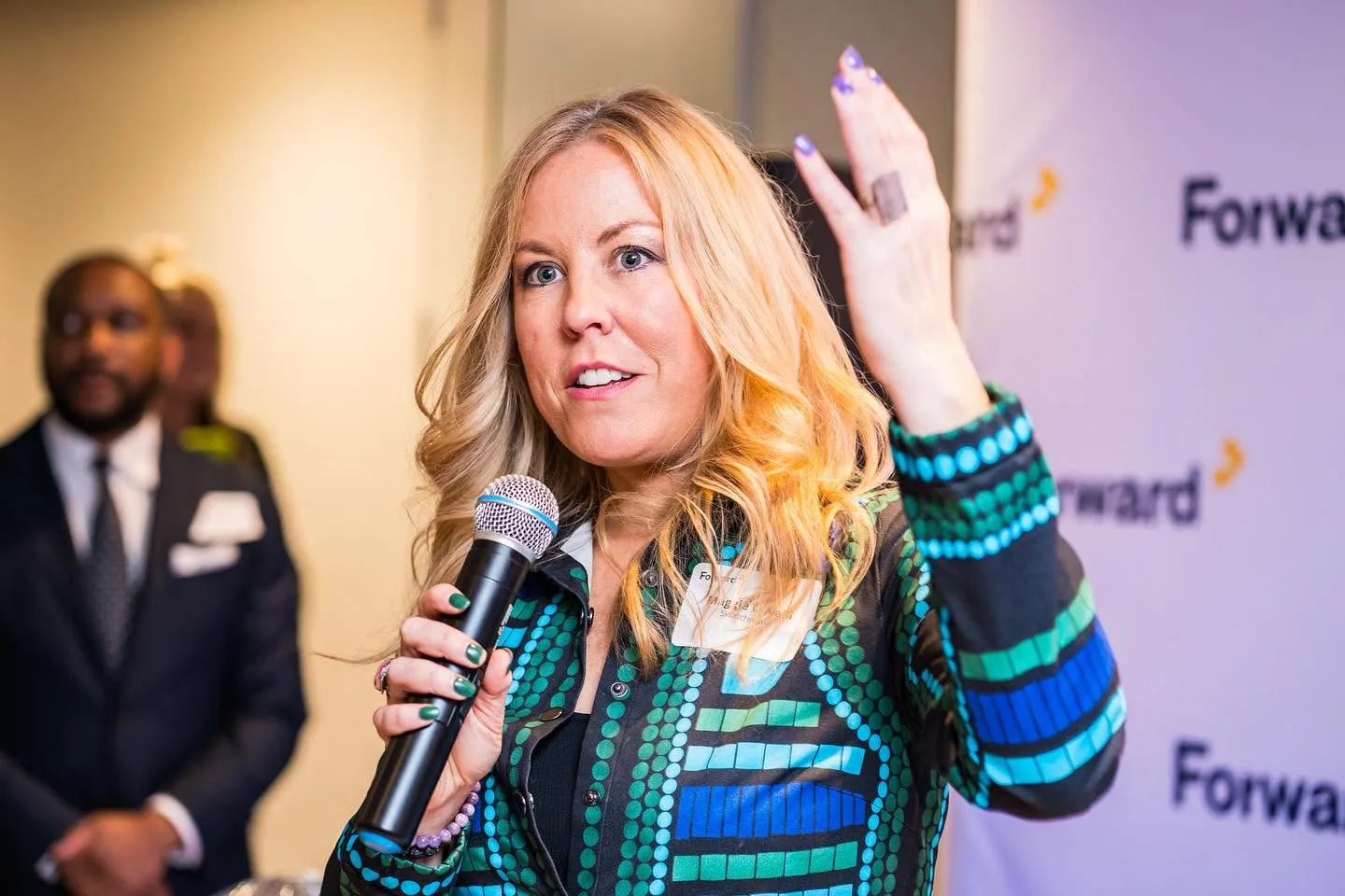 Speaker addressing guests at a corporate event in the Washington DC area