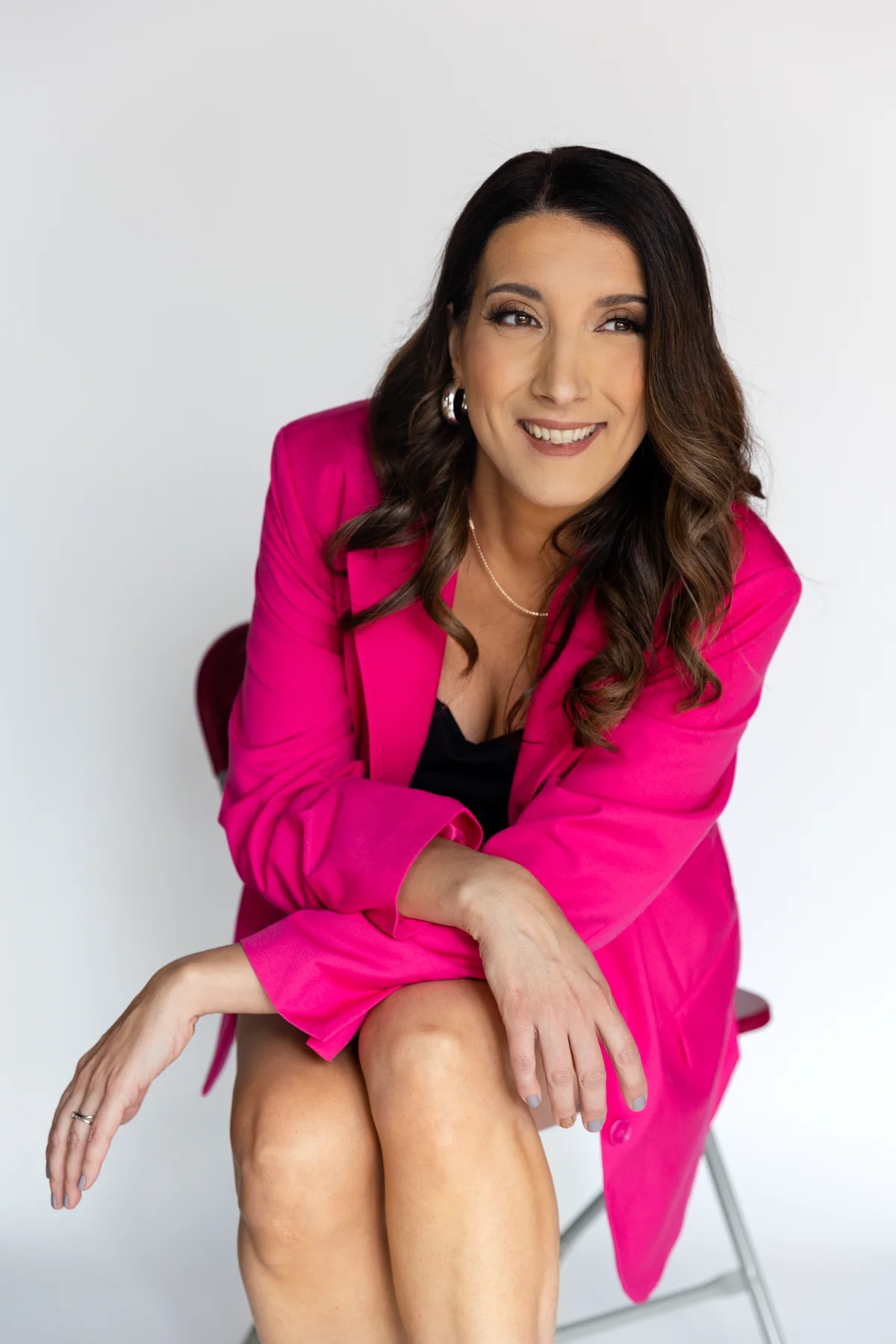 Silvia Alexiev, founder of Anotherframe Studio, smiling in a pink blazer